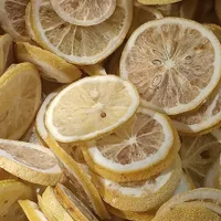 A layer of pale yellow dried lemon slices seen from above.